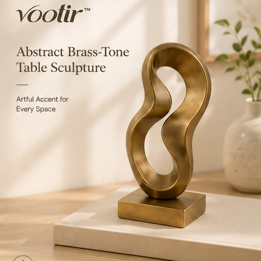 𝒗𝒐𝒐𝒊𝒕𝒊𝒓 abstract brass-tone loop table sculpture on a neutral display book